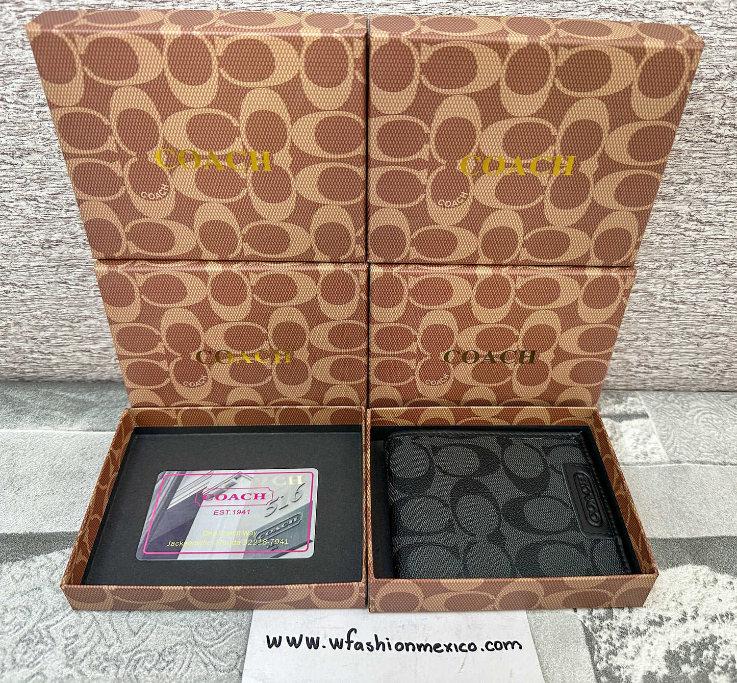 Cartera negra C0ach con monograma